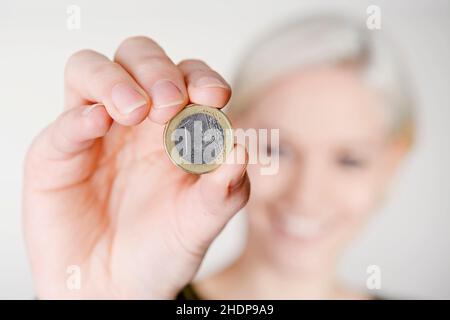 Junge Frau, sparen, Münze, 1 Euro, Mädchen, Mädchen, Frau, junge Frauen, spart, Münzen, Ein Euro Stockfoto