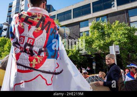 Supporters of Novak Djokovic, the men's world number one tennis player, demonstrate outside the immigration detention facility where the tennis star is being held. Carlton Melbourne, Victoria, Australia Stock Photo