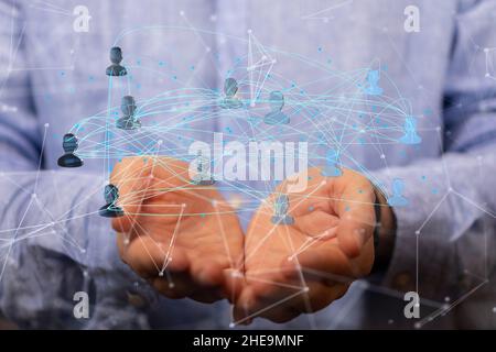Flacher Fokus der menschlichen Hände halten miteinander verbundene menschliche Symbole für Netzwerk-Konzept Stockfoto