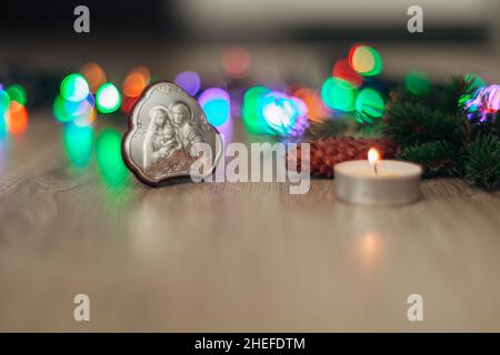 Christmas Composition of Church Icon on a Wooden Background With Multicolored Boken Stock Photo
