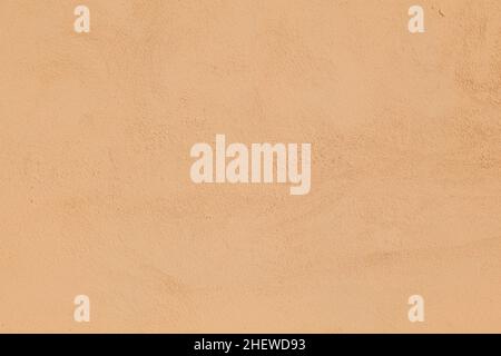 Alte ockerfarbene Wand gibt einen harmonischen Hintergrund Stockfoto