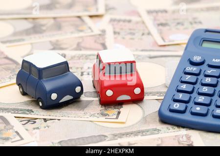 Kleines Spielzeugauto-Bild auf japanischen zehntausend Yen Scheinen Banknoten Stockfoto