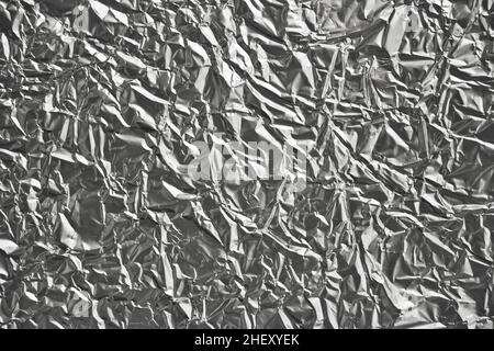 Nahaufnahme der zerknittert silbernen Aluminiumfolie. Abstrakter Hintergrund für Design. Stockfoto