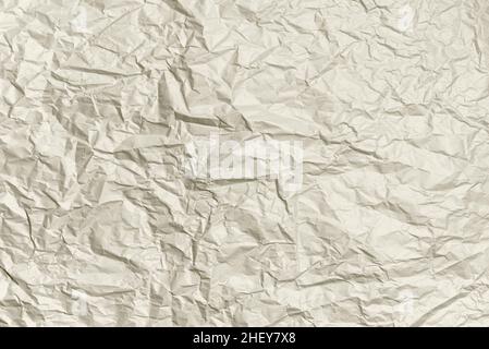 Zerknittertes Papier, elfenbeinfarbene Textur. Abstrakter Hintergrund. Modell für Ihr Design Stockfoto