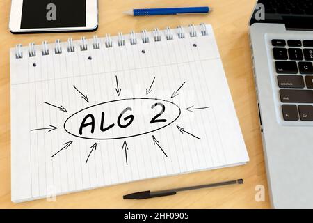 ALG2 - Arbeitslosengeld 2 - deutsch für Arbeitslosengeld oder Geld einzahlen - handgeschriebener Text in einem Notizbuch auf einem Schreibtisch - 3D Darstellung. Stockfoto
