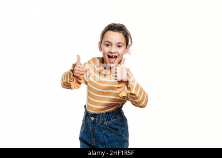 Bild von glücklichen jungen Mädchen isoliert auf weißem Hintergrund zeigt Daumen nach oben Geste. Stockfoto