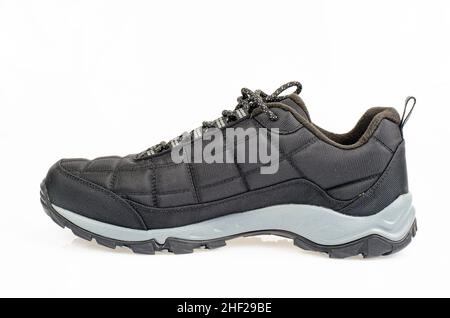 Schwarze, isolierte Sportschuhe auf weißem Hintergrund. Studio Photo Stockfoto