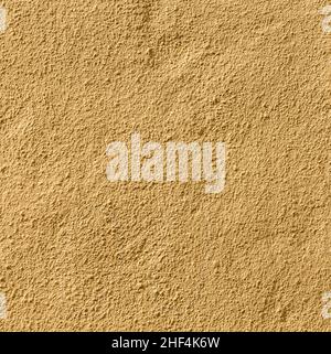 Ockerfarbener Wandhintergrund gibt ein harmonisches Muster Stockfoto