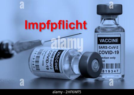 Zwangsimpfung gegen Corona mit Impfstoff Stockfoto