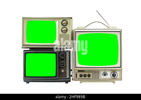 Drei Vintage-Fernseher, isoliert auf Weiß, mit grünen Chroma-Tasten-Bildschirmen. Stockfoto