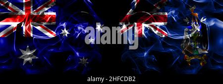 Flaggen von Australien, Australien gegen Großbritannien, Großbritannien, Südgeorgien und den Südlichen Sandwichinseln. Rauchfahne nebeneinander auf schwarzem Hintergrund platziert. Stockfoto