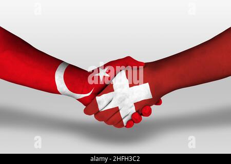 Handschlag zwischen schweiz und türkei Flaggen auf Händen gemalt, Illustration mit Clipping Path. Stockfoto