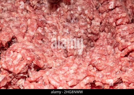 Frisch gemahlenes Rindfleisch. Hackgut Textur und Hintergrund Stockfoto