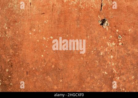 Verwitterte orange Wand Hintergrundstruktur Stockfoto