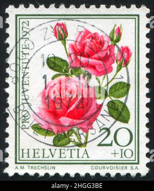 SCHWEIZ - UM 1972: Briefmarke gedruckt von der Schweiz, zeigt Blumenrose, um 1972. Stockfoto