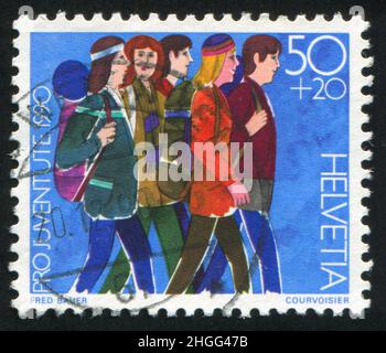 SCHWEIZ - UM 1990: Briefmarke gedruckt von der Schweiz, zeigt Jugendgruppen, um 1990 Stockfoto