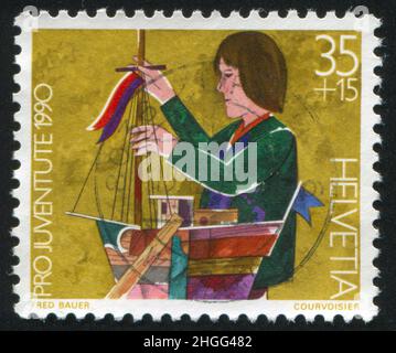 SCHWEIZ - UM 1990: Briefmarke gedruckt von der Schweiz, zeigt Modellbau, um 1990 Stockfoto