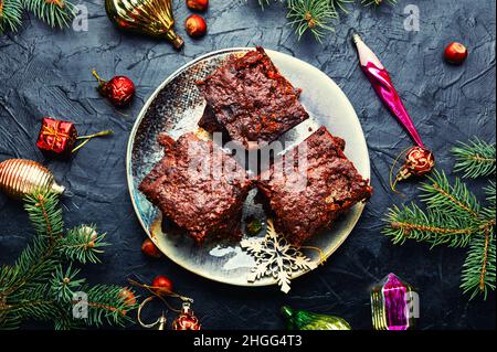 Panforte, eine ungewöhnlich leckere Weihnachtsleckerbissen aus getrockneten Früchten und Nüssen. Italienisches Weihnachtsgebäck Stockfoto