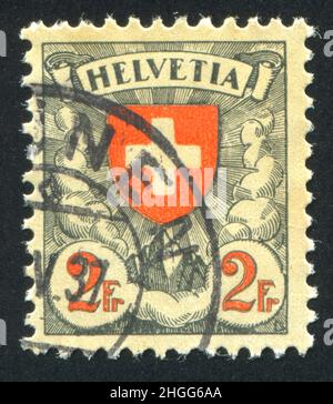 SCHWEIZ - UM 1924: Briefmarke gedruckt von der Schweiz, zeigt Kreuz, um 1924. Stockfoto