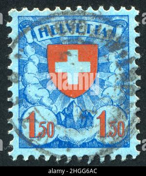 SCHWEIZ - UM 1924: Briefmarke gedruckt von der Schweiz, zeigt Kreuz, um 1924. Stockfoto