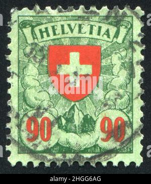 SCHWEIZ - UM 1924: Briefmarke gedruckt von der Schweiz, zeigt Kreuz, um 1924. Stockfoto