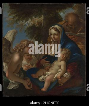 Die Heilige Familie mit Engeln ca. 1700 Sebastiano Ricci Italienisch Sebastiano Ricci, ein Künstler von bemerkenswerter Einrichtung und Erfindung, hat sich einen Ruf in ganz Europa erarbeitet. Diese Heilige Familie spiegelt Riccis Bewunderung für das Werk von Ludovico Carracci wider. Er hätte reichlich Gelegenheit gehabt, Ludovico's Gemälde zu studieren, als er etwa 1678 von Venedig nach Bologna zog. Bemerkenswert sind die intime Behandlung des Themas und die bebrillte Figur des heiligen Joseph beim Lesen eines Buches. Die Heilige Familie mit Engeln. Sebastiano Ricci (Italienisch, Belluno 1659–1734 Venedig). Ca. 1700. Öl auf Leinwand. Gemälde Stockfoto