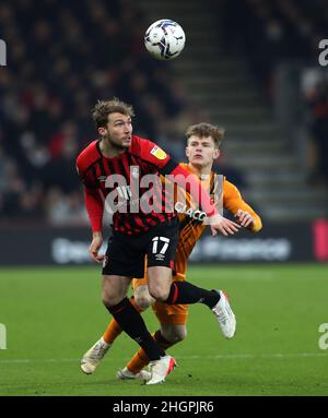 Bournemouth's Jack Stacey (left) and Hull City's James Scott battle for the ball during the Sky Bet Championship match at the Vitality Stadium, Bournemouth. Picture date: Saturday January 22, 2022. Stock Photo