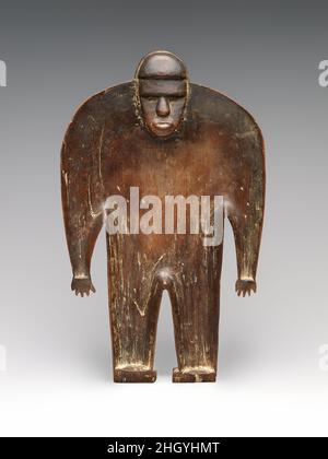 Ritualgericht (daveniyaqona) Fijian Anfang des 19th. Jahrhunderts Dieses bemerkenswerte skulpturale Gefäß ist außergewöhnlich elegant in seinem Design und genial für seinen formalen Erfindungsreichtum. Es ist nicht einfach nur ein Kunstwerk, sondern ein Gefäß, das als Vehikel konzipiert wurde, um Kontakt mit den Göttern der Vorfahren zu schaffen. In einer radikalen Neuinterpretation der Form hat der Meisterschnitzer, der sie schuf, die kühne Abstraktion einer kraftvollen Physiognomie mit den zarten Konturen eines Behälters verschmolzen. Trotz seines intimen Ausmaßes strahlt die sich abzeichnende Ahnenfigur eine kraftvolle Präsenz aus, die die tiefe Abstammung von Beziehungen verkörpert, die Akt waren Stockfoto