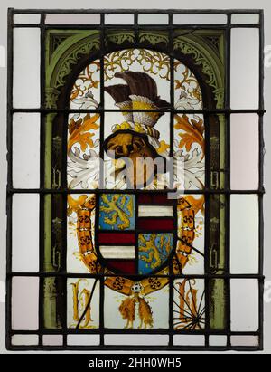 Heraldische Tafel mit Wappen des Hauses Habsburg ca. 1504–6 Südniederländisch die Gravensteen (Burg des Grafen) in Gent war die Hauptdomäne der Habsburger in Südflandern. Diese Buntglasscheibe, die vermutlich aus dieser kaiserlichen Residenz stammt, gehört zu einer größeren Serie, die entweder von Maximilian I. oder Karl V. bestellt wurde. Heraldische Tafel mit Wappen des Hauses Habsburg. Südniederländisch. Ca. 1504–6. Glas aus Metall, Weißglas, Glasfarbe und Silberfleck. Hergestellt in Gent. Glasmalerei Stockfoto