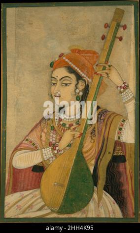 Eine Dame spielt die Tanpura Ca. 1735 Indien (Rajasthan, Kishangarh) als Nayika (archetypische Heldin) verkörpert diese Figur das Ideal weiblicher Schönheit, wie es in der indischen Devotionalpoesie dieser Zeit konzeptualisiert wurde. Sie schrumpt ein Tanpura, trägt aufwendigen Schmuck und schiere Textilien und platziert sie eindeutig als Mitglied des Hofes. Zur gleichen Zeit gibt es die Anspielung, dass sie Radha ist, die göttliche Gemahlin von Krishna, die für diese Kishangarh-Gönner wichtig war. Eine Dame spielt die Tanpura 38038 Stockfoto