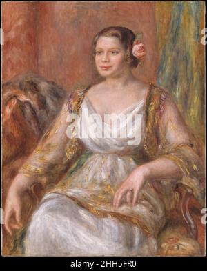 Tilla Durieux (Ottilie Godeffroy, 1880–1971) 1914 Auguste Renoir Französisch im Juli 1914, kurz vor Ausbruch des Ersten Weltkriegs, reiste die berühmte deutsche Schauspielerin Tilla Durieux mit ihrem Mann, dem Kunsthändler Paul Cassirer, nach Paris, um für Renoir zu posieren. Das klassizistierende, pyramidale Format dieser Komposition verleiht dem Sitter eine gewisse Pracht, gekleidet in dem Kostüm, das die Modedesigrikerin Poiret 1913 für ihre Rolle als Eliza Doolittle in George Bernard Shaws Pygmalion entwarf. Als Renoir dieses ehrgeizige Porträt malte, war er so verkrüppelt von Arthritis, dass er in einem Rollstuhl wi sitzen musste Stockfoto