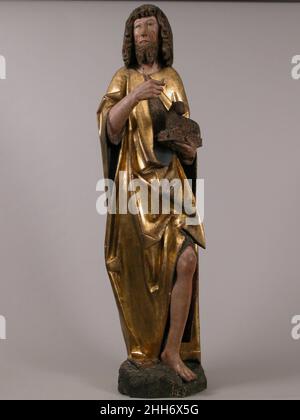 Johannes der Täufer 15th–16th Jahrhundert Deutsch als Vorläufer des Kommens Christi hält Johannes der Täufer ein Lamm, das Christus als das Lamm Gottes symbolisiert. Diese Skulptur und die Statue des heiligen Johannes des Evangelisten auf der anderen Seite des Tores waren zwei von vier Statuen aus einem großen geschnitzten Tisch. Johannes der Täufer 468051 Stockfoto