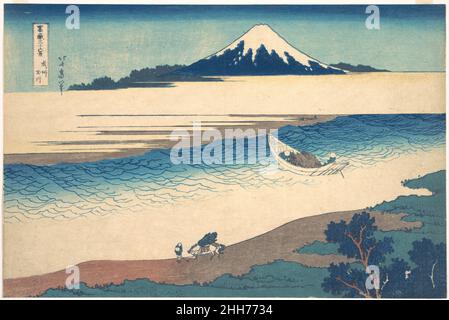Tama-Fluss in der Provinz Musashi (Bushū Tamagawa), aus der Serie 36 Ansichten des Fuji-Berges (Fugaku sanjūrokkei) ca. 1830–32 Katsushika Hokusai die Japanerin fährt auf dem klaren Wasser des Tama River ein kleines Fährschiff mit Ästen und Zweigen. Seine Bewegung in die Tiefen des Drucks lenkt den Blick des Betrachters auf den heiligen Berg, der in der Ferne aufsteigt. Fujis tiefblaue Färbung entspricht der der Bäume an der nahen Küste und schafft so eine formale Verbindung zwischen Hintergrund und Vordergrund. Die einseitige Figur, die ein Packpferd am ruhigen Ufer führt, trägt zur Gelassenheit der Szene bei. Tama River i Stockfoto