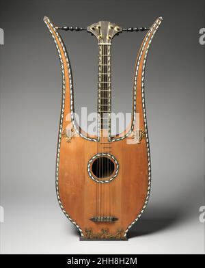 Lyre Guitar Early 19th Century French Dieses Instrument trägt ein Label für Francisco Lupot, aber es ist unwahrscheinlich, dass es vom berühmten Geigenbauer hergestellt wurde. Sein tatsächlicher Hersteller bleibt unbekannt. Lyre-Gitarre. Französisch. Anfang 19th Jahrhundert. Fichte, Zeder, Ebenholz, Messing, Elfenbein. Frankreich. Chordophon-Lautenzupfen Stockfoto