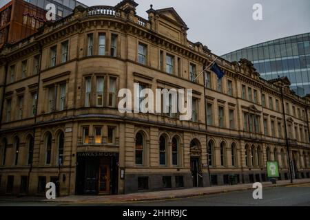 Hawksmoor Steakhouse Gebäude in Deansgate, Manchester, erbaut in einem sandigen, gelben Stein, mit beeindruckenden architektonischen Details. Stockfoto