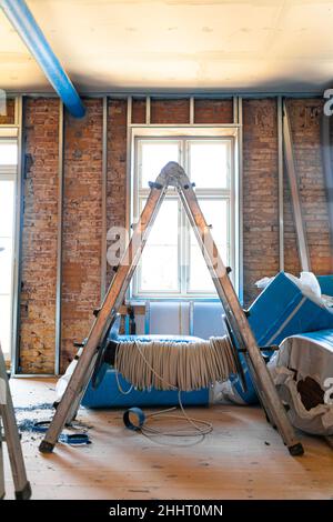 Silver ladder at construction site Stockfoto