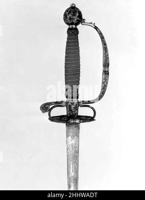 Smallsword-Griff und Klinge ca. 1730 Griff, japanisch, möglicherweise Dejima; Klinge, Europäische Schwertklinge aus europäischer Mode, hergestellt aus shakudō, einer Legierung aus Kupfer und Gold, patiniert auf die blau-schwarze Farbe, die in Japan für kleine dekorative Objekte wie Schwertbefestigungen verwendet wurde, Wurden wahrscheinlich für die Dutch East India Company an ihrem Handelsposten auf der japanischen Insel Deshima hergestellt. Hiltelemente wie diese wurden dann nach Holland exportiert, wo sie mit Griffen und Klingen ausgestattet wurden. Smallsword-Griff und Klinge 22933 Stockfoto