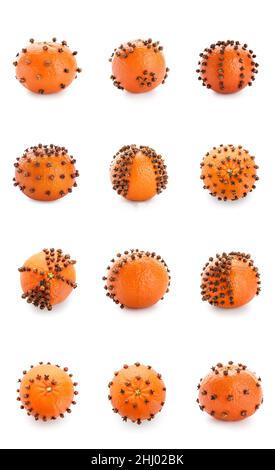 Set aus orangefarbenen Pomanderkugeln auf weißem Hintergrund Stockfoto