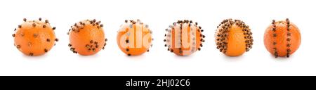 Set aus orangefarbenen Pomanderkugeln auf weißem Hintergrund Stockfoto