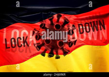 FOTOMONTAGE, Coronavirus vor Deutschlandfahne mit Schriftzug Lockdown, Symbolfoto für die Corona-Pandemie in Deutschland Stockfoto