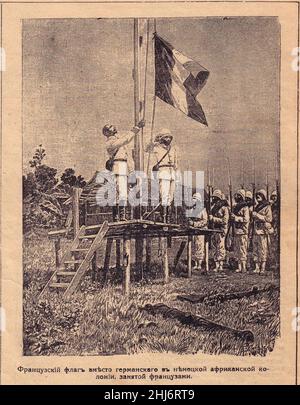 Wechseln Sie die deutsche Flagge in Afrika auf Französisch aus der Zeitschrift 20 Century. Stockfoto