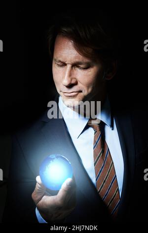 Die Welt in seiner Hand Stockfoto