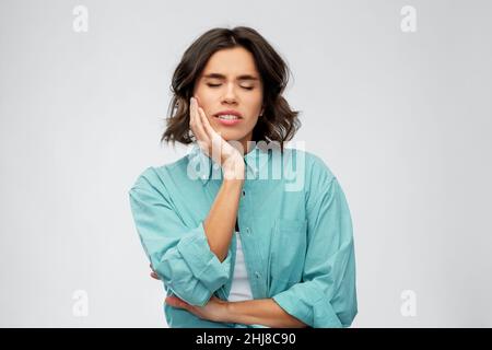 Junge Frau mit Zahnschmerzen Stockfoto