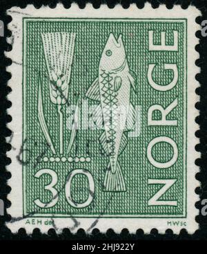 POLTAVA, UKRAINE - 27. Januar 2022. Vintage Stempel gedruckt in Norwegen um 1964 Ohr und Fisch Stockfoto