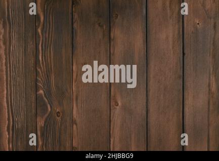 Verbrannte alte Platine. Texturbretter aus dunkelbraunem altem Holz. Stockfoto