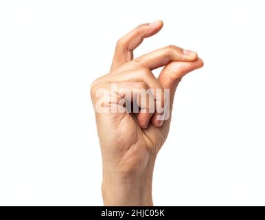 Studioaufnahme eines nicht erkennbaren Mannes, der seine Finger vor einem weißen Hintergrund schnappt Stockfoto