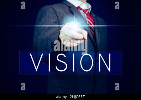 Vision - Schriftzug, Geschäftsmann zeigt mit dem Finger Stockfoto