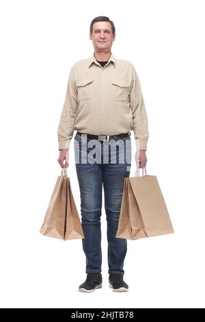 Gut aussehender junger Mann mit Einkaufstaschen Stockfoto
