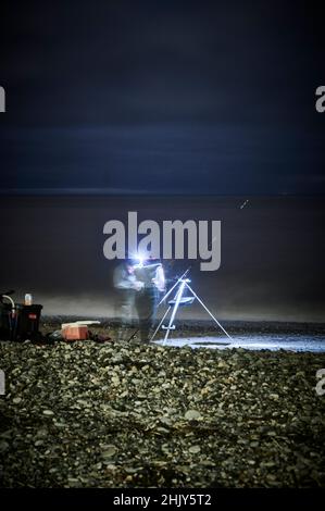 Nachtangeln vor Rossall Beach, Fleetwood, Großbritannien Stockfoto