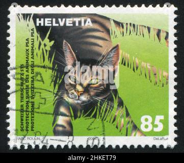 SCHWEIZ - UM 2004: Briefmarke gedruckt von der Schweiz, zeigt Katze, um 2004 Stockfoto